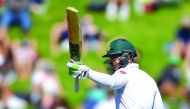 South Africa's Quinton de Kock celebrates after scoring 50 runs during day two of the second Test cricket match against New Zealand at the Basin Reserve in Wellington.
