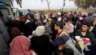 Displaced Iraqi people from different areas in Mosul wait to be transferred to a safe area during a battle between Iraqi forces and Islamic State militants, in the city of Mosul, Iraq March 18, 2017. REUTERS/Youssef Boudlal.