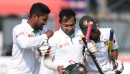 Bangladesh captain Mushfiqur Rahim (C) and teammates celebrate their victory over Sri Lanka by four wickets on the fifth and final day of the second and final Test cricket match between Sri Lanka and Bangladesh at The P. Sara Oval Cricket Stadium in Colom