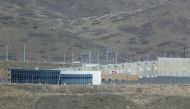 An American flag flies in front of the entrance of the NSA's Utah data collection center on March 17, 2017 in Bluffdale, Utah. George Frey/Getty Images/AFP