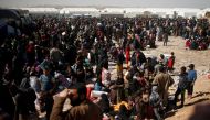 Displaced Iraqis wait to enter Hamam al-Alil camp south of Mosul, Iraq March 10, 2017. Picture taken March 10, 2017. REUTERS/Suhaib Salem