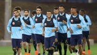 Qatar national team players taking part in a training session under the watchful eyes of coach Jorge Fossati in Doha yesterday.