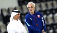 Qatar Football Association (QFA) President Sheikh Hamad bin Khalifa bin Ahmed Al Thani and coach Jorge Fossati talk to each other during yesterday's  training session.