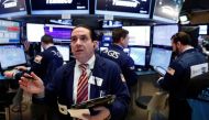Traders work on the floor of the New York Stock Exchange (NYSE) shortly after the opening bell in New York, U.S., March 21, 2017. REUTERS/Lucas Jackson.