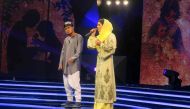 (FILES) This file photo taken on March 9, 2017 shows young Afghan singer Zulala Hashemi (R) alongside competitor Sayed Jamal Mubarez as they perform during the television music competition 'Afghan Star' in Kabul. AFP / Anne CHAON