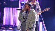 (FILES) This file photo taken on November 19, 2016 shows rapper Kendrick Lamar onstage during the 2016 American Music Awards at Microsoft Theater on November 20, 2016 in Los Angeles, California. AFP / KEVIN WINTER