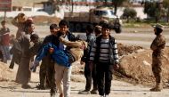 Displaced people are checked by Iraqi forces as Iraqi forces battle with Islamic State militants, in western Mosul, Iraq March 25, 2017. REUTERS/Suhaib Salem