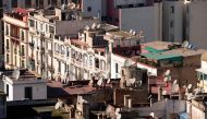 A picture taken on February 15, 2016 shows the rooftops of old buldings in central Casablanca where poor locals have built shanty homes. AFP / FADEL SENNA