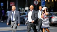 South Africa's Finance Minister Pravin Gordhan (L) walks with his deputy, Mcebisi Jonas as they walk from their offices to a court hearing in Pretoria, South Africa, March 28,2017. REUTERS/Siphiwe Sibeko