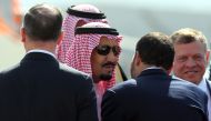 The Custodian of the Two Holy Mosques King Salman bin Abdulaziz al-Saud of Saudi Arabia and Jordanian King Abdullah II attend a welcome ceremony at the airport in the Jordanian capital Amman on March 27, 2017 ahead of the 28th Summit of the Arab League. A