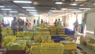 File photo of fishermen preparing their stocks for auction at the fish market at the Central Market Doha.