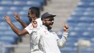 This file photo taken on February 23, 2017 shows India's captain Virat Kohli (R) and teammate Ravichandran Ashwin celebrate after the dismissal of Australia's captain Steve Smith during the first day of the first cricket Test match between India and Austr
