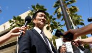 Hawaii Attorney General Douglas Chin talks to the media at the US District Court Ninth Circuit after seeking an extension after filing an amended lawsuit against President Donald Trump's new travel ban in Honolulu, Hawaii, March 29, 2017. Reuters/Hugh Gen