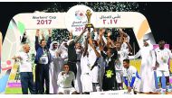 Nakheel Landscapes team players and officials celebrate with the Workers Cup 2017 trophy.