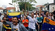 Opposition supporters shout slogans during a protest against Venezuelan President Nicolas Maduro's government in San Cristobal, Venezuela March 31, 2017. REUTERS/Carlos Eduardo Ramirez