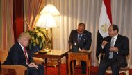 This file photo taken on September 20, 2016 shows then-Republican presidential candidate Donald Trump (L) looking on as Egyptian President Abdel Fattah el-Sisi speaks during a meeting at the Plaza Hotel in New York. (AFP / DOMINICK REUTER)