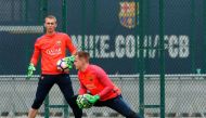 Barcelona's goalkeepers Jasper Cillessen (L) from Netherlands and Marc-Andre ter Stegen from Germany take part in a training session at the Sports Center FC Barcelona Joan Gamper in Sant Joan Despi, near Barcelona on April 1, 2017. / AFP / PAU BARRENA
