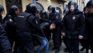 Policemen detain a man during an unsanctioned anti-government protest in Moscow, Russia, April 2, 2017. REUTERS/Maxim Shemetov