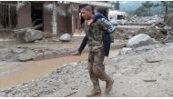 Colombian soldiers evacuate victims of a deadly avalanche that happened following heavy rains in Macoa, Putumayo Colombia on April 01, 2017. / AA.