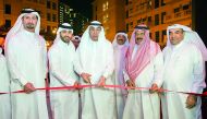 Hussain Alfardan, owner, Alfardan Group, and Fardan Fahad Hussain Alfardan, owner, Gymmito, and other officials cutting the ribbon to open Gymmito Fitness Club at Qanat Quartier.