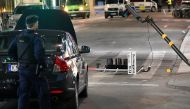 A run down traffic sign for 'Drottninggatan' is seen inside the roped off area outside the department store Ahlens after a suspected terror attack on the on the pedestrian street Drottninggatan in central Stockholm, Sweden, April 8, 2017. Maja Suslin/TT N