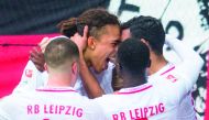 Leipzig's Yussuf Poulsen (centre) celebrates after scoring a goal against Leverkusen during their Bundesliga game, yesterday.  