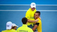 Nick Kyrgios of Australia carries team captain Lleyton Hewitt as they celebrate Australia's victory over the US after Kyrgios' match against Sam Querrey in the world group quarter-final Davis Cup clash between Australia and the USA in Brisbane on April 9,