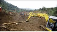 Rescue team search for more than two dozen people who were missing after a rain-triggered landslide struck a village in Ponorogo, East Java, Indonesia, on April 02, 2017. ( Stringer - Anadolu Agency ).
