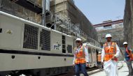 REPRESENTATIVE IMAGE: Workers walk at the site of the under-construction Riyadh Metro rail system on August 26, 2015 (Faisal / Al Nasser Reuters)