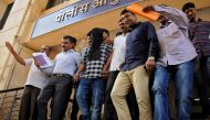 Police officials escort Sagar Thakkar, the suspected mastermind in the Internal Revenue Service (IRS) call center scams, to a police station in Thane, on the outskirts of Mumbai, India, April 8, 2017. REUTERS/Stringer 