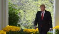 US President Donald Trump makes his way to the Rose Garden for Neil Gorsuch's swearing-in ceremony as an associate justice of the US Supreme Court at the White House on April 10, 2017 in Washington, DC. / AFP / MANDEL NGAN
