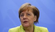 German Chancellor Angela Merkel attends a press conference following a meeting with global economic leaders in the chancellery in Berlin on April 10, 2017. AFP / MICHELE TANTUSSI
