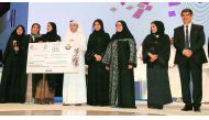 H E Dr Mohammed Abdul Wahed Ali Al Hammadi, Minister of Education and Higher Education, and Dr Abdul Sattar Al Taie, Executive Director, QNRF, with the winners of the National Scientific Research Competition Grand Awards.