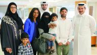 Osman and his family with members from Sidra.