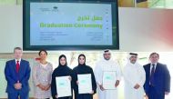 Qatar Foundation interns with officials.