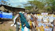 A woman carrying food provided by RAF at an aid distribution centre at a drought-affected village in Ethiopia.