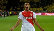 TOPSHOT - Monaco's French forward Kylian Mbappe Lottin reacs after scoring during the UEFA Champions League 1st leg quarter-final football match BVB Borussia Dortmund v Monaco in Dortmund, western Germany on April 12, 2017.  AFP / Sascha Schuermann
