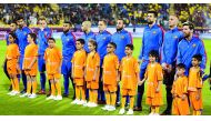 Kids representing Save the Dream accompany Barcelona players ahead of their match against Saudi Arabia's Ahli in Doha, in this December 2016 file photo.  