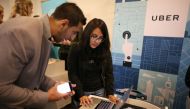 REPRESENTATIVE IMAGE: Uber recruiter Lorena Castellanos talks to job seeker Masood Noori at TechFair LA, a technology job fair in Los Angeles (REUTERS / Lucy Nicholson) 