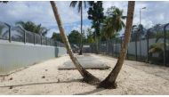 File Photo: Security fences can be seen near trees inside the Manus Island detention centre in Papua New Guinea, February 11, 2017. Behrouz Boochani/Handout via REUTERS/File Photo