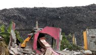 A damaged house is seen during a rescue mission after a garbage dump collapsed and buried dozens of houses in Colombo, Sri Lanka April 15, 2017. REUTERS/Dinuka Liyanawatte