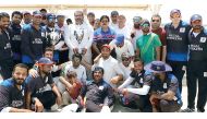 The players of Khetco XI  and Regal Strikers pose for a group photo following the final of Qatar Airways Twenty20 Tournament at West Bay Gound recently.  