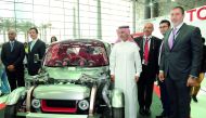 Officials with the Toyota KIKAI model at the Qatar Motor Show.  Pic:  Salim Matramkot / The Peninsula