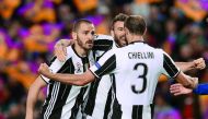 Juventus' defender Giorgio Chiellini (right) celebrates their qualification with team-mates at the end of the UEFA Champions League quarter-final second leg match against FC Barcelona at the Camp Nou Stadium in Barcelona on Wednesday. Juve claimed a 3-0 w