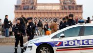 Police patrol at the Trocadero near the Eiffel Tower after a policeman was killed and two others were wounded in a shooting incident in Paris, France, April 21, 2017. REUTERS/Charles Platiau
