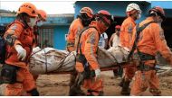 Search and rescue team members conduct an operation to rescue victims of the landslide that triggered by a flood following heavy rains in Mocoa, Putumayo, Colombia on April 03, 2017.