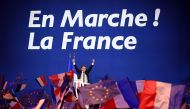 French presidential election candidate for the En Marche ! movement Emmanuel Macron waves at the audience during a meeting at the Parc des Expositions in Paris, on April 23, 2017, after the first round of the Presidential election. AFP / Eric FEFERBERG
