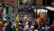 Opposition supporters attend a rally in support of political prisoners and against Venezuelan President Nicolas Maduro, in downtown Los Teques, Venezuela April 28, 2017. REUTERS/Marco Bello TPX IMAGES OF THE DAY
