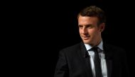 French presidential election candidate for the En Marche ! movement Emmanuel Macron addresses supporters at the Angerlarde hall in Chatellerault, western France on April 28, 2017.  AFP / Eric FEFERBERG
