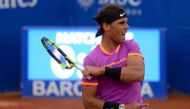 Spanish tennis player Rafael Nadal returns the ball to Argentinian tennis player Horacio Zeballos during the ATP Barcelona Open 